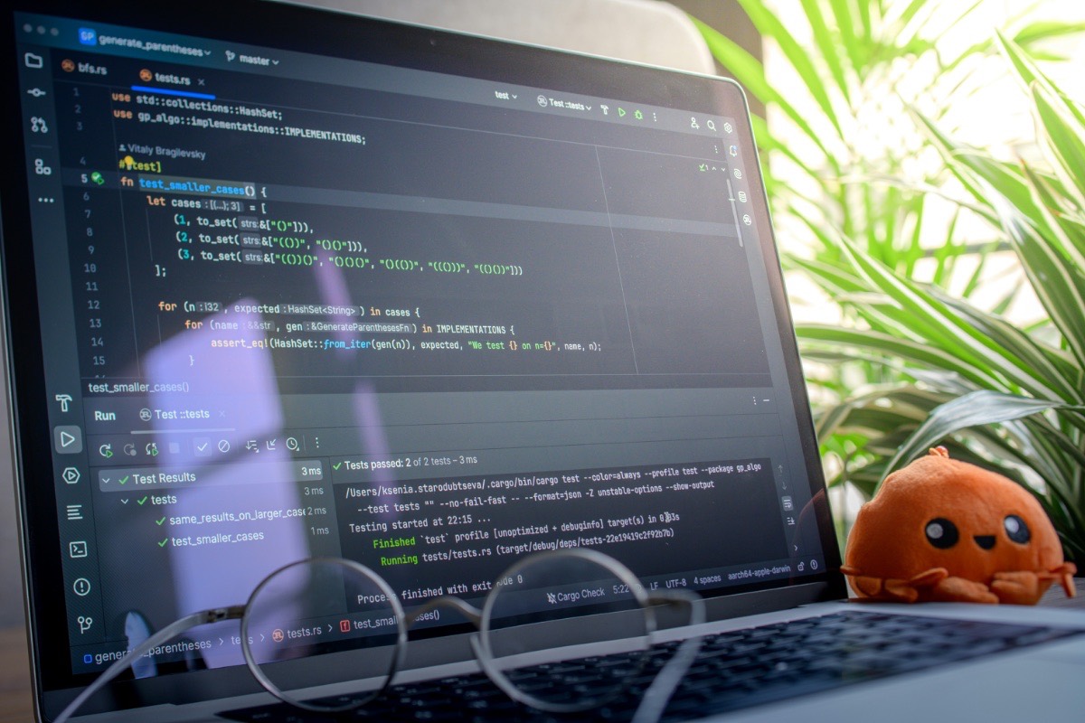 Developer workstation with code editor open, evaluating software development work